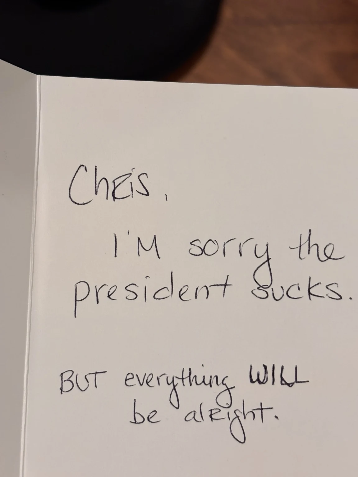Handwritten note from Katie to Chris reading: I'm sorry the president sucks. But everything WILL be alright.