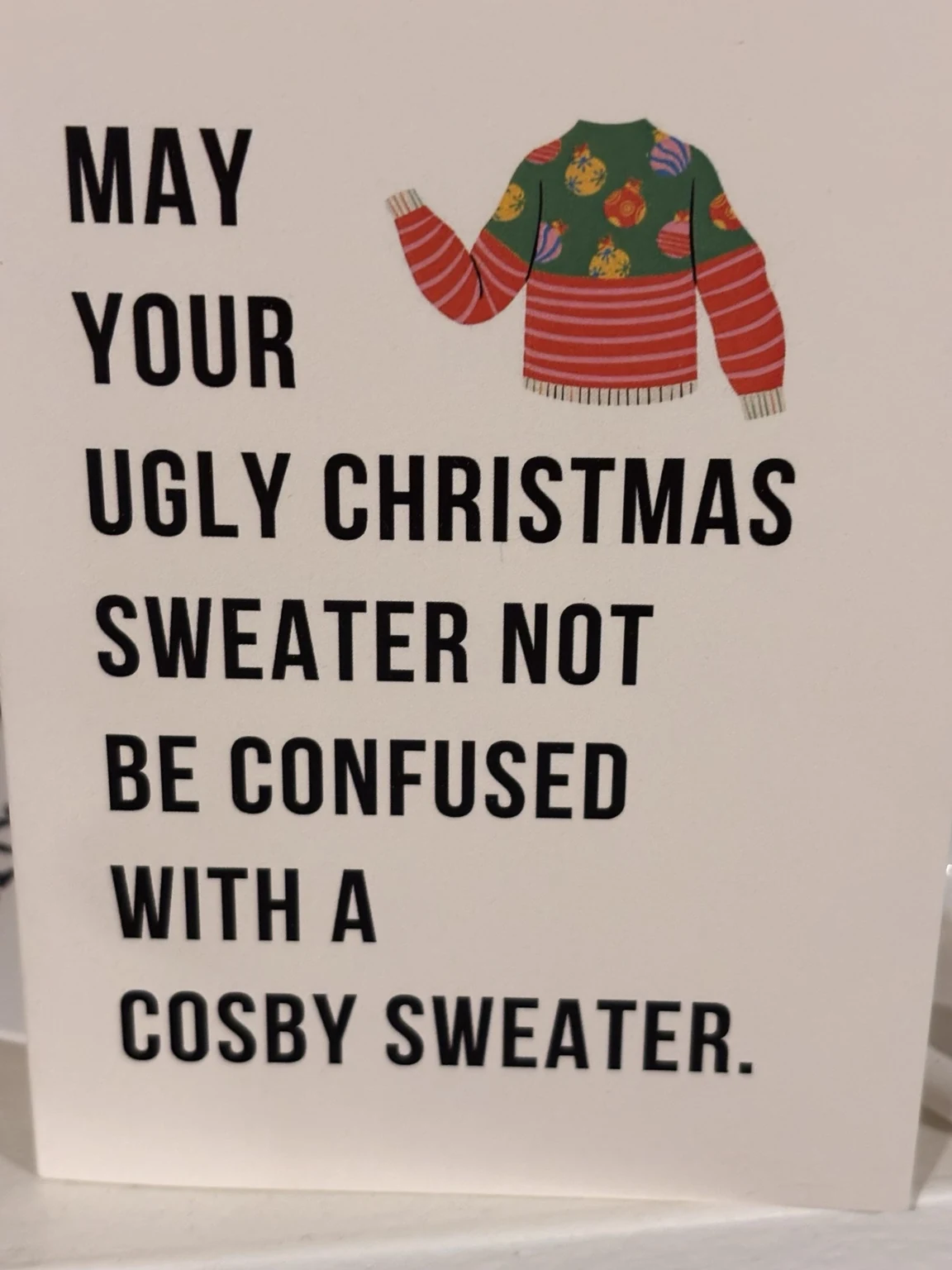 Handwritten card from Katie: May your ugly Christmas sweater not be confused with a Cosby sweater.